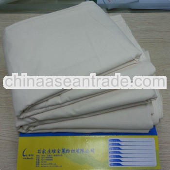 flat white cotton bed sheets