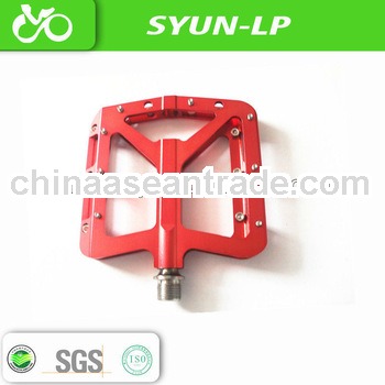 titanium mountain bike pedaling